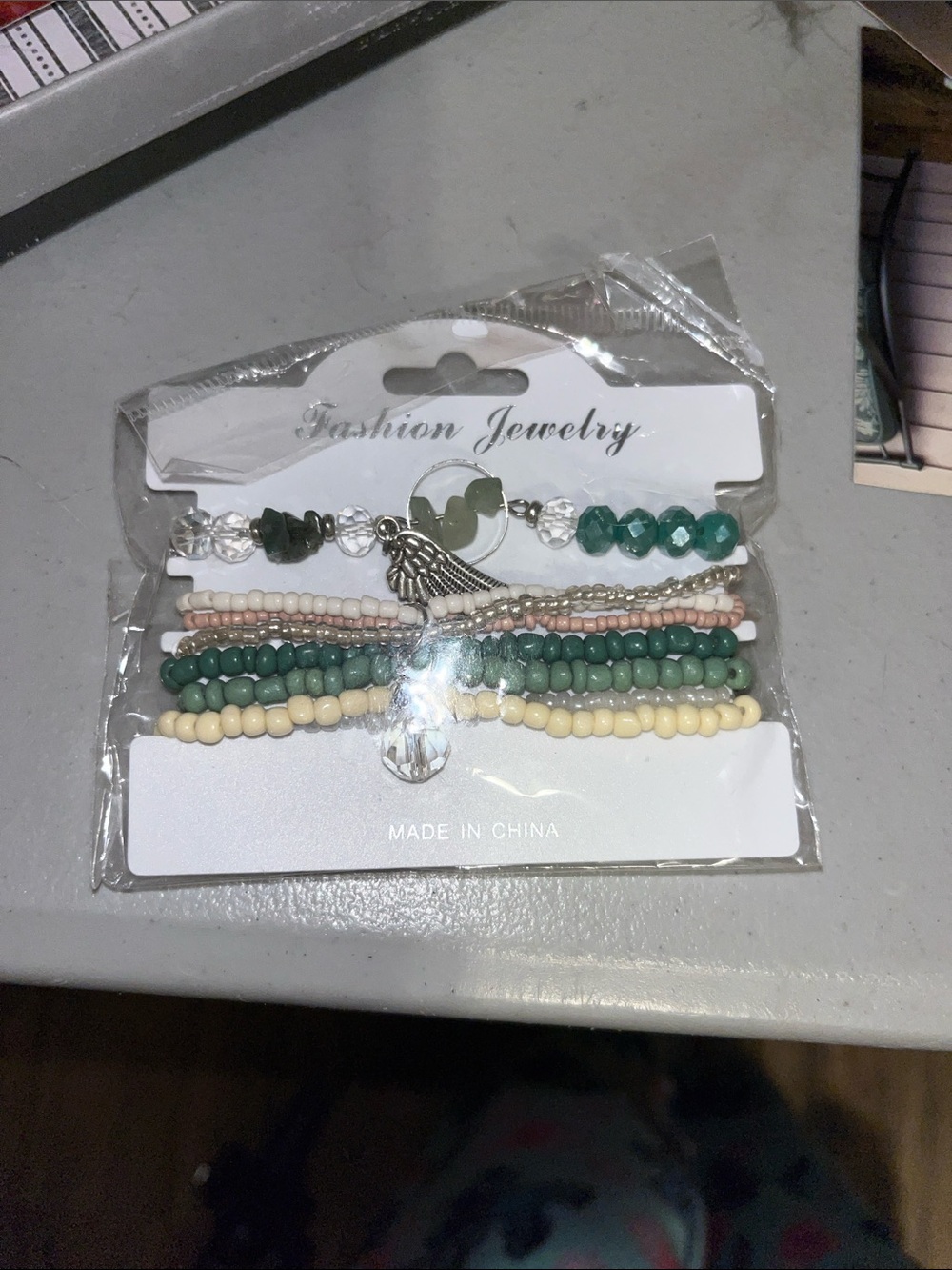 Fashion Jewelry Green and Cream Beaded Bracelet Stack with Silver Wing Charm